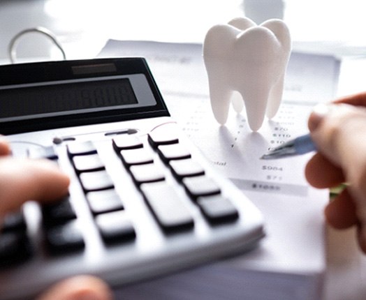 A patient trying to calculate the cost of cosmetic dentistry