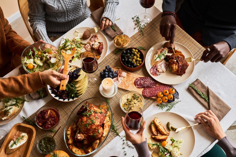 A high angle view of friends enjoying Thanksgiving foods that stain teeth